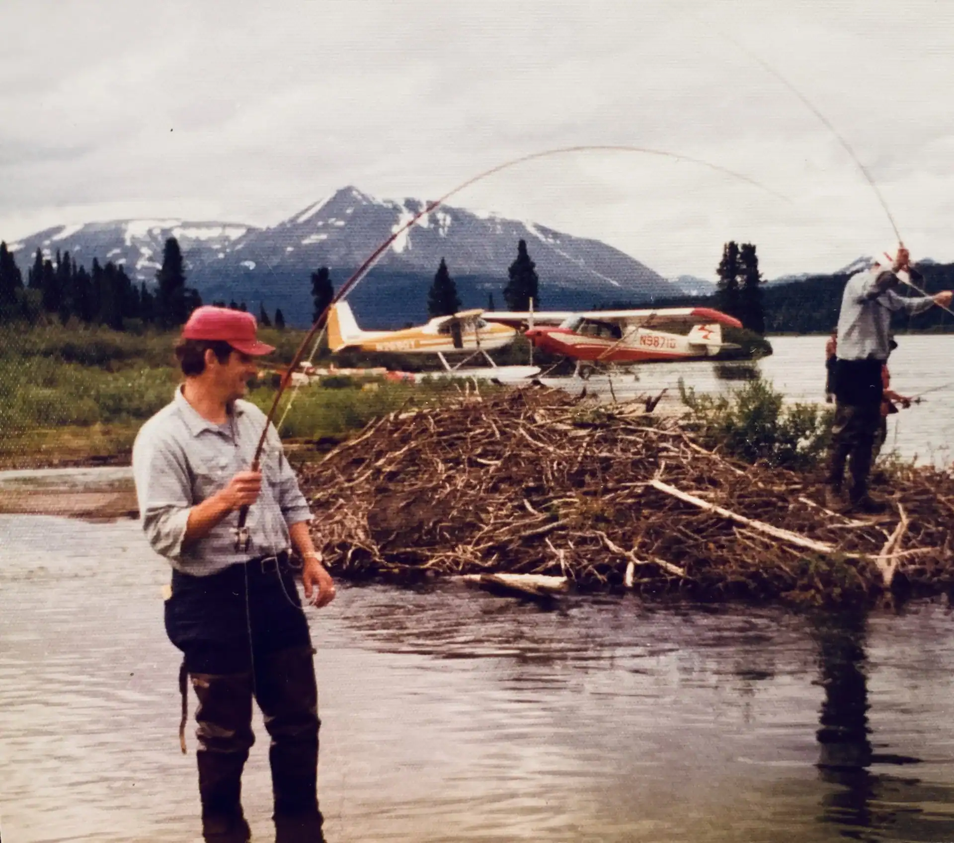 Chuck fishing with a plane in the background