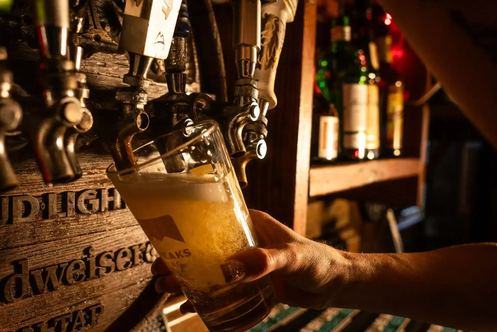 Ice cold beer on draft getting poured at Q Bar and Grill, a local bar located in Deer Valley North Phoenix