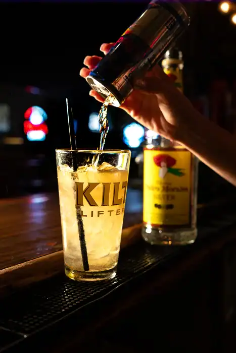 Q Bar cocktail being poured at the cocktail bar in North Phoenix