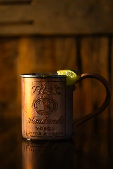 Q Mule in a rustic mug, a signature cocktail spinoff at Q Bar and Grill